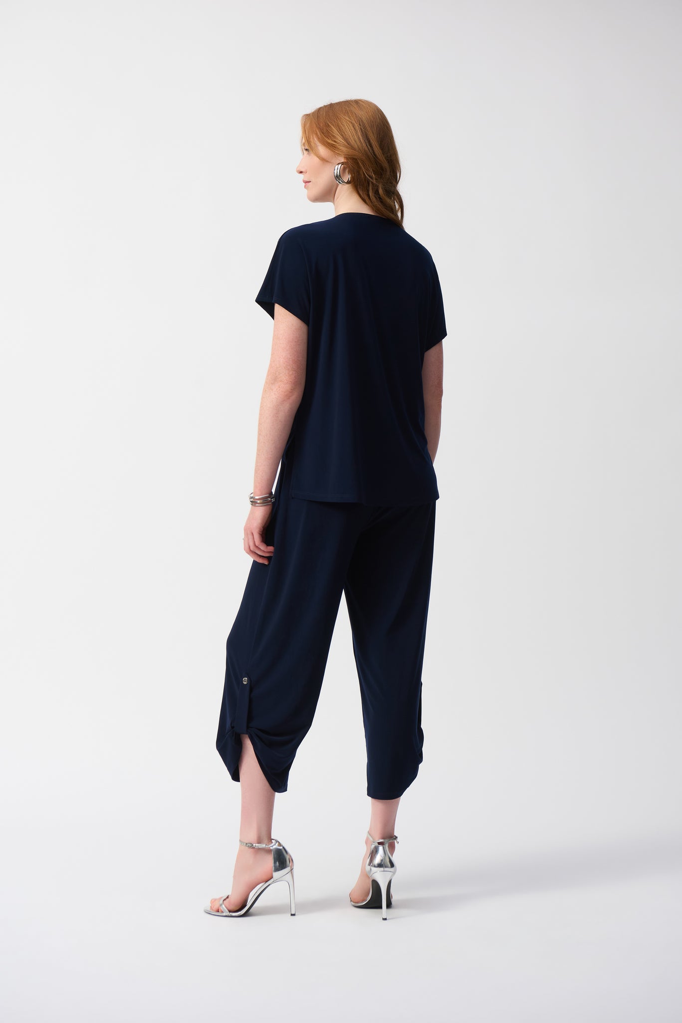 joseph ribkoff silky culotte jumpsuit in navy (back)