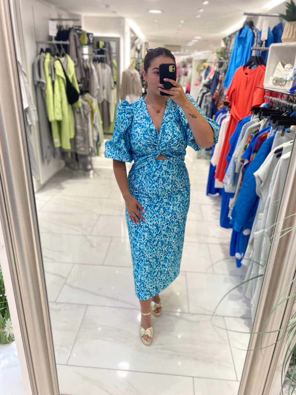 Exquise puff sleeve midaxi length dress with vneck twist front and cutout detail in turquoise white and blue spot print (front)