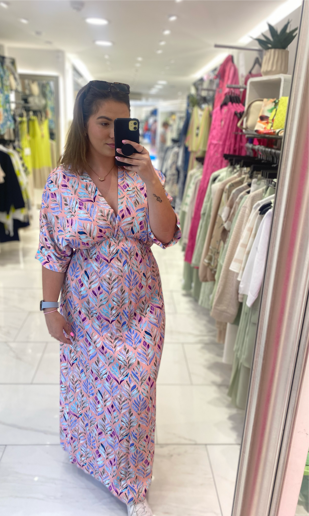 Deck leaf printed maxi dress with v-neck, empire waistline and bat-wing style top in peachy pink with blue and purple print (front) 