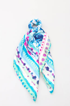 Tie dye print neck scarf in blue, purple and turquoise. 80% polyester 20% silk 